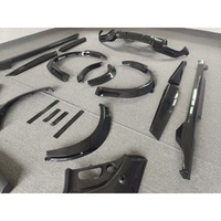 Kit de carrosserie en fibre de carbone sèche style OEM pour Ferrari Purosangue : lèvre avant, jupes latérales, diffuseur arrière, couvre-cabine et kit d'arches de roue