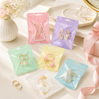 100 pièces/sac Sachets holographiques en Mylar à fermeture éclair pour bijoux, poudres, aliments secs, noix, bonbons, emballage irisé