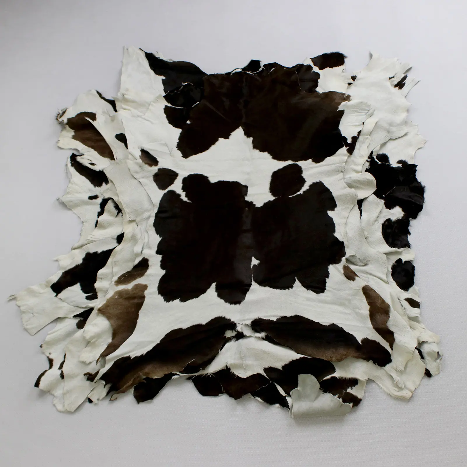 Natural black and white calfskin leather hide