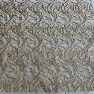 Tissu en maille à paillettes douces avec revêtement adhésif pour vêtements de mode - Product Image 1