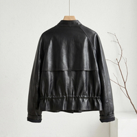 Veste en cuir de mouton noir vintage pour femme, col montant, patte de boutonnage asymétrique, veste courte en véritable peau de mouton avec poches