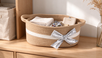 Panier de rangement ovale en corde de coton avec poignées et nœud décoratif argenté, bac de rangement tressé pour chambre d'enfant, bureau, cosmétiques et rangement domestique