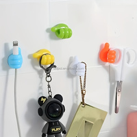 Crochet mural auto-adhésif créatif en silicone en forme de pouce pour clés, organisateur de câbles de données et de fils pour la maison et le bureau