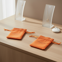 Pochette d'emballage de bijoux de luxe en microfibre orange faite à la main avec fermeture à nouer et doublure en velours personnalisée