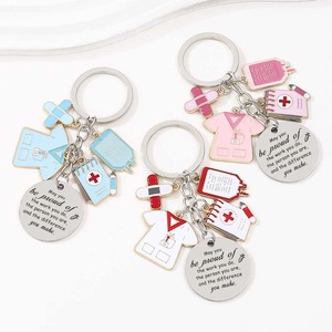 Nouveau jour de l'infirmière sac à dos crochet avec goutte à goutte huile alliage porte-clés pendentif bricolage contenu circulaire pendentif cadeau de vacances - Product Image 1