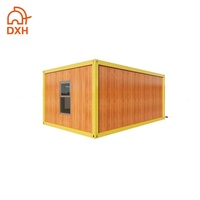Garage préfabriqué en conteneur, modèle DXH, en acier moderne, prix bas, installation rapide, pour maison individuelle, avec porte à enroulement électrique.
