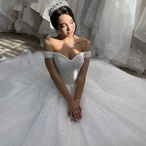 White Off The Shoulder Ball Gown Wedding Dress With Lace And Tassel Details Natural Waistline V Neck Style - Product Image 3