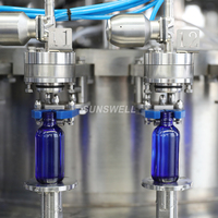 Machine automatique de remplissage, d'étiquetage et d'emballage de bouteilles en verre pour boissons gazeuses, eau gazeuse, eau pure et eau tonique