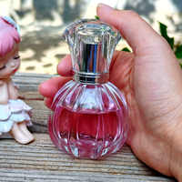 Flacon de parfum en verre transparent de 50 ml, forme cylindrique, col fileté de 15 mm, gravure personnalisée, design unique, avec emballage boîte.
