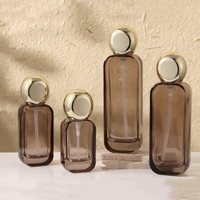 Ensemble de flacons de soin en verre ambré transparent avec pompe et pots à couvercle en aluminium doré, disponibles en 30ml, 50ml, 100ml, 120ml, 30g, 50g, pour crème