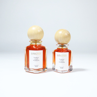 Flacon de parfum en verre cylindrique de luxe 30ml 50ml 100ml, emballage vide haut de gamme, avec bouchon sphérique et sérigraphie mate givrée