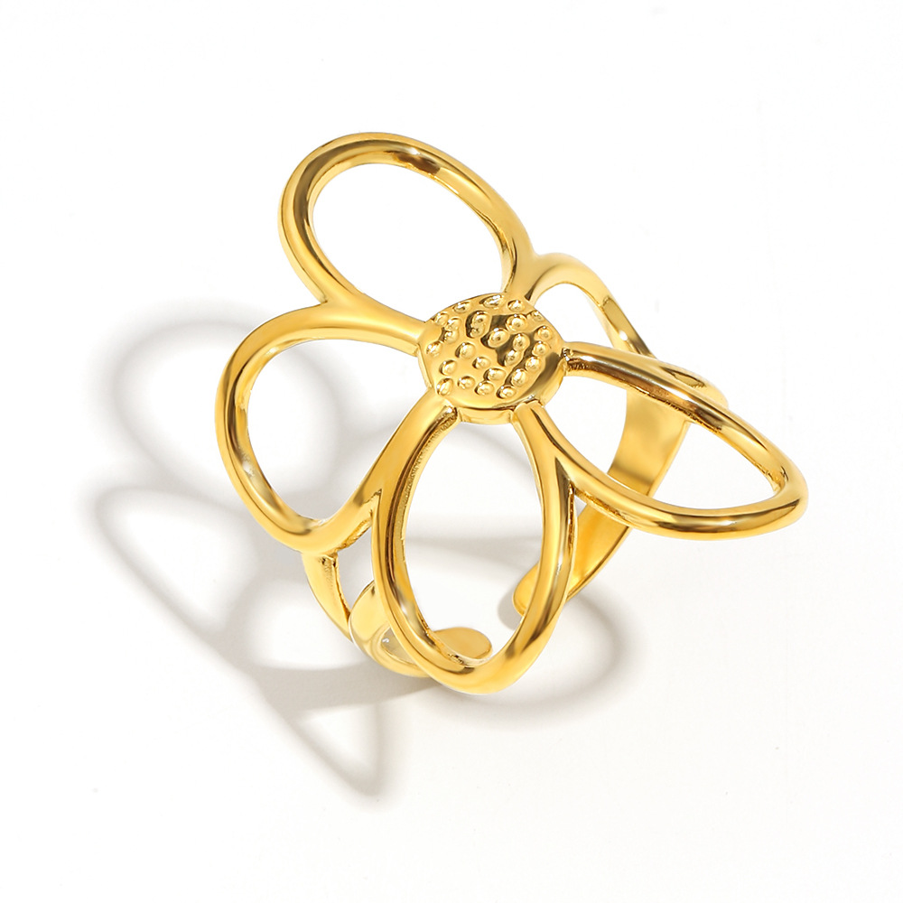 Anillo abierto con flor, línea dorada.
