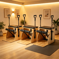 Chaise de Pilates en chêne avec pédale fendue, barres réglables et poignée en D, idéale pour studio de fitness de 100 m²