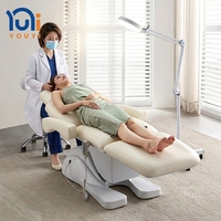 Lit de beauté électrique de luxe pour esthéticienne, avec base en plastique courbée, pour soins du visage, cils et massage en spa
