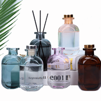 Vente en gros pot d'aromathérapie en rotin de luxe bouteille conteneur parfums liquides parfum de maison vide bâtonnets de roseau diffuseur bouteille en verre