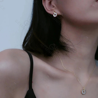 Parure de bijoux Gemnel en argent 925 avec pendentif cercle double entrelacé en nacre et zirconiums blancs pavés, et boucles d'oreilles pendantes