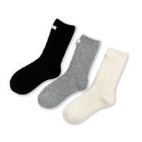 Chaussettes mi-mollet douces et confortables en mélange de laine pour femme, avec étiquette décorative, idéales pour l'hiver, vente en gros personnalisée