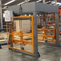Machine automatique de superposition de palettes pour ligne de production de blocs de béton