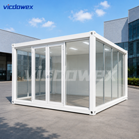 VICDOWEX - Showroom en conteneur préfabriqué - Mur-rideau en verre - Design contemporain - Modulaire - Préfabriqué - Pour immeuble de bureaux - Entrepôt