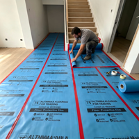 Tapis de protection pour sols, idéal pour la rénovation et le déménagement, résistant aux rayures, durable et sans résidus, pour carrelages et parquets.