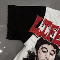 Kaos Raglan Pria Life Hustlers Model Distressed dengan Grafis Cutout, Warna Hitam Putih Kontras, Lengan Pendek, Streetwear