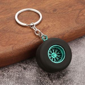 Promotion Porte-clés Pendentif en PVC souple style dessin animé, en forme de pneu de voiture, avec accessoires métalliques artificiels et modèle de moyeu de roue modifié en silicone - Product Image 4