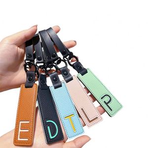 Porte-clés en cuir PU avec pendentif lettre, alphabet A-Z, pour clés de voiture, cadeau pour portefeuille, sac à dos, accessoires de charme pour sac - Product Image 1