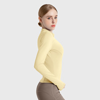 Veste de sport décontractée de haut de yoga de fitness amincissante respirante à haute élasticité avec col montant