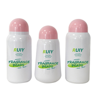 OEM/ODM Bouteille distributeur en plastique personnalisable avec couvercle blanc rose perles de rétention de parfum bouchon à vis détergent à lessive