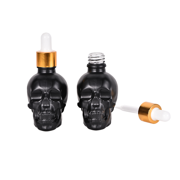 Amazon Hot Matte Frosted Black Skull Glass Dropper Serum Bottle Skull Cosmetic Essential Oil Bottle with Non-childproof Caps