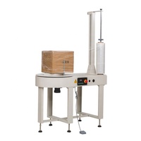 Machine d'emballage électrique à film étirable compacte avec moteur pour cartons, palettes et bagages - Applications alimentaires et de boissons