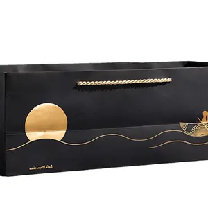 Luxury High-end Rectangle Gold Foiled Sunrise from Sea Outline Printed Matted Black Durable Paper Bag with Golden Rope Handle