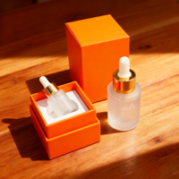 Boîte cadeau personnalisée pour flacon compte-gouttes d'huile essentielle de parfum recyclable avec emballage rigide, gaufrage et pelliculage mat orange
