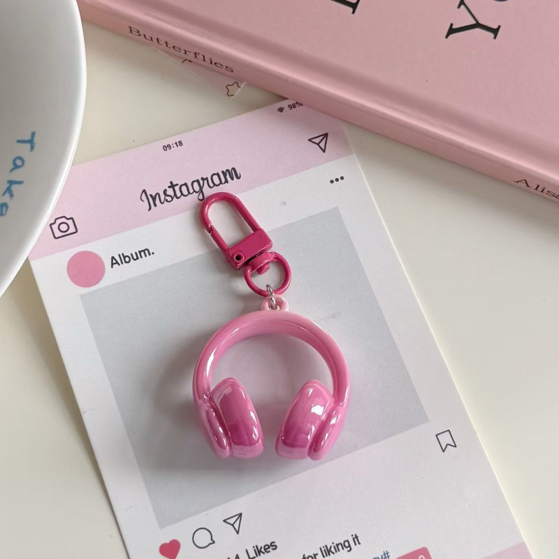 Porte-clés écouteurs rose poudré