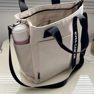 Sac fourre-tout élégant et imperméable en toile, nouveau design, simple, polyvalent, à porter à l'épaule, en nylon, pour l'école, les livres, le déjeuner, été, automne - Product Image 1