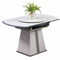 Table à manger compacte extensible contemporaine en pierre frittée avec structure en bois d'hévéa, design transformable, option hôtel/villa