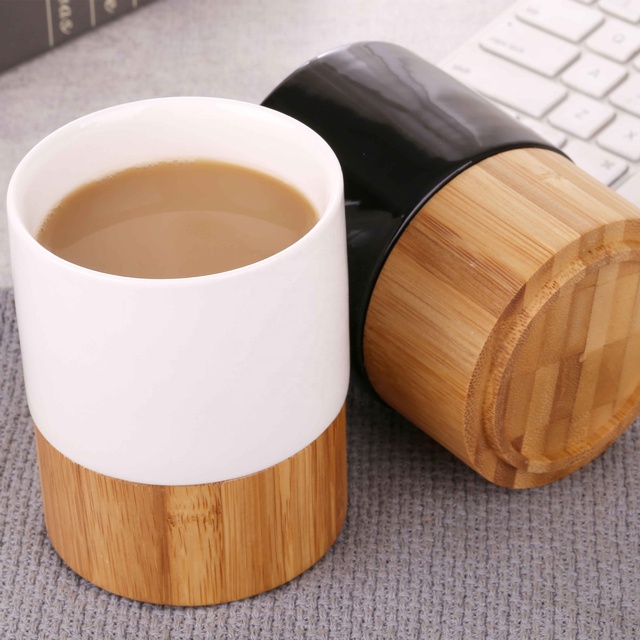 New Hot Sale White and Black Reusable Tea Milk Ceramic Mug Custom Logo Porcelain Coffee Cup With Bamboo Bottom