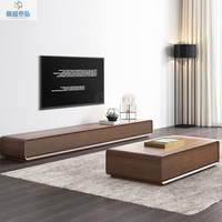 Meuble TV en bois contrasté noir et blanc avec rangement spacieux, tiroirs sans poignées, et table basse contemporaine – Ensemble moderne pour salon