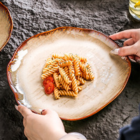Nouvelle assiette à salade en porcelaine rétro irrégulière, durable et de haute qualité, en céramique cuite au four