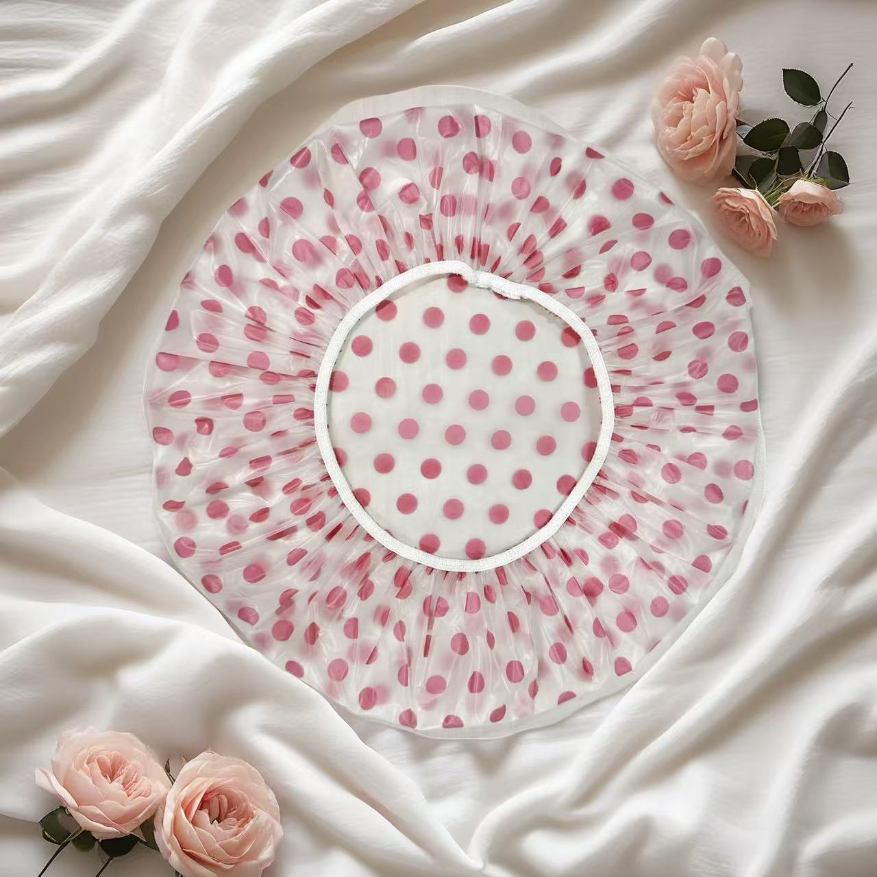Elástico de mano de 5s de grosor con puntos rosas.