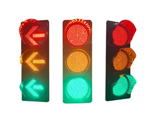 Red and green portable pedestrian traffic light flashing yellow arrow