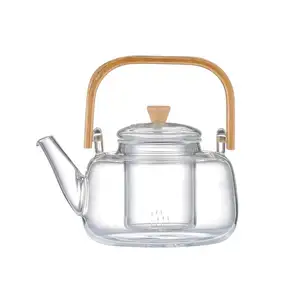 มือทำกาน้ำชาแก้วที่มีเครื่องทำความร้อน/แก้วหม้อชา/บนโต๊ะอาหาร/ชุดชา