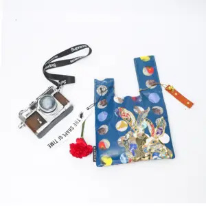 Mini sacola de compras reutilizável artesanal com alça de pulso, carteira e carteira com design de nó