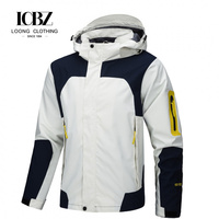 Veste à capuche pour sports de plein air pour hommes, couleur bleue, blocs de couleurs, coque imperméable, rabat anti-vent, poignets à velcro, coupe-vent technique, ODM personnalisé
