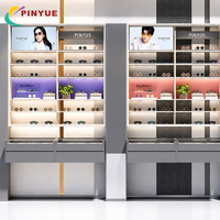 Vitrine de présentation modulaire rose et blanche avec étagères grillagées lumineuses et rangement LED pour boutiques de beauté