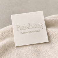Étiquettes tissées de luxe, logo personnalisé, marque privée, étiquettes de col en satin ivoire gaufrées 3D, étiquettes tissées pour vêtements de créateurs