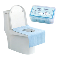 Housse de siège de toilette jetable en gros, emballée en boîte, imperméable, hygiénique, non tissée, pour voyage et hôtel
