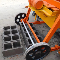 Machine à fabriquer des blocs de béton de type pondeuse mobile à faible coût, machine manuelle portable à briques creuses en ciment pour petites entreprises