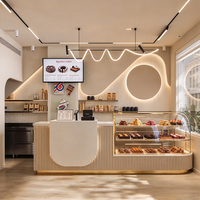 Comptoir de bar à café avec vitrine intégrée pour pâtisseries, unité de rangement et d'exposition pour la vente au détail, idéal pour les cafés ou les boulangeries