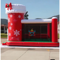 Château gonflable de Noël personnalisable avec toboggan pour fêtes et locations d'attractions en centre commercial